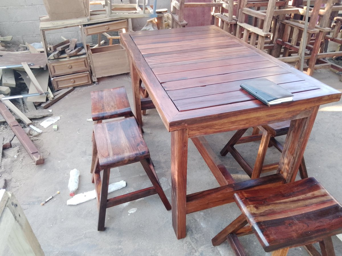 mvie17's tweet photo. Readily available is this rustic teak diner set, it has 6 beautifully handcrafted stools and a solid rustic teak table. Very durable and strong type of wood, you can have it forever and will increase in value with passing time. Contact me on +263717105918 app or calls(Vic Falls) https://t.co/fgv8lkZaeO