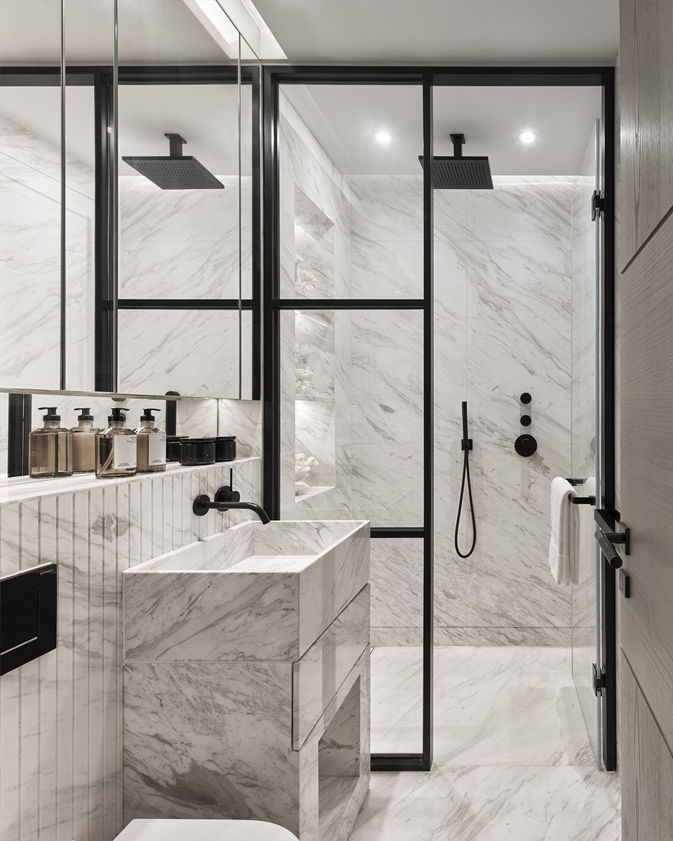 The before and after of the apartment always fascinates me even when I have designed it ! I just love the transformation and the magic wand effect it has. Sleek lines, hidden lighting mixed with marble and woods... #kellyhoppendesign #beforeandafer #bathroomdesign