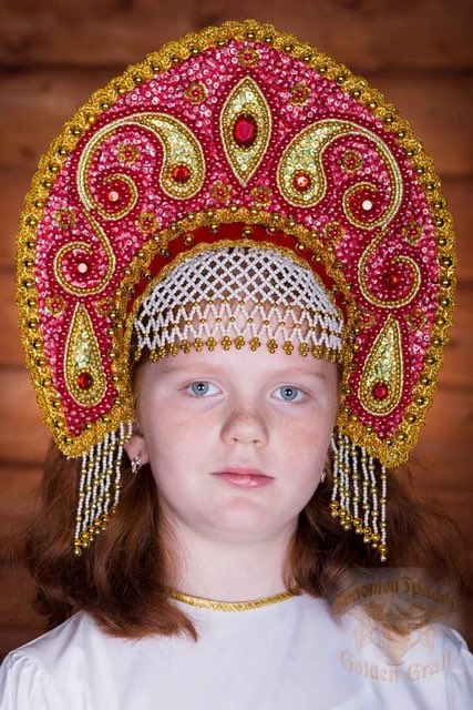 Exquisite Russian Kokoshnik: Timeless Elegance for All Ages

Crafted on a sturdy base, the Kokoshnik boasts intricate fabric-brocade, filled with meticulous stuffing and adorned with a medley of cord, Braid hedgehog, beads, sequins, and pearls. Standing at 16 cm tall, it fastens