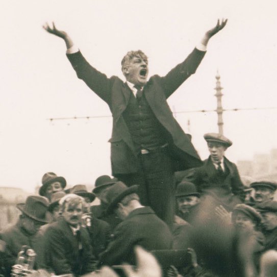 OTD in 1923 a crowd of thousands welcome Jim Larkin back to Dublin after a nine-year absence in the United States. The photo that inspired the monument on O'Connell Street was taken by Joe Cashman. It captures Larkin’s towering stature and powerful oratorical style.