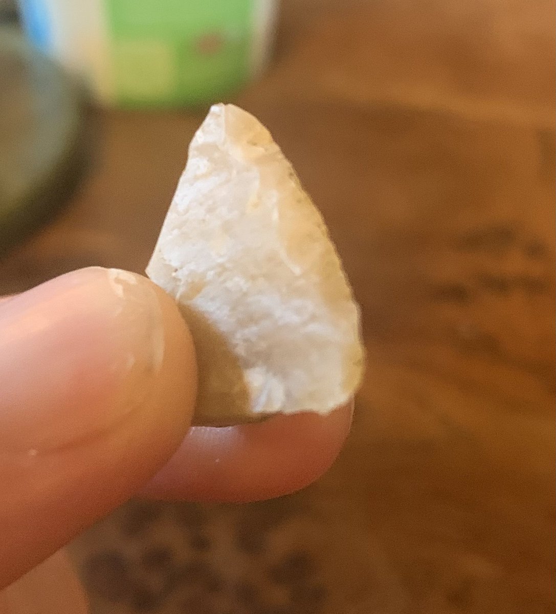 My son found this flint in a coastal area with little flint around. Is it a triangular geometric microlith? Can anyone tell me if it has been knapped?