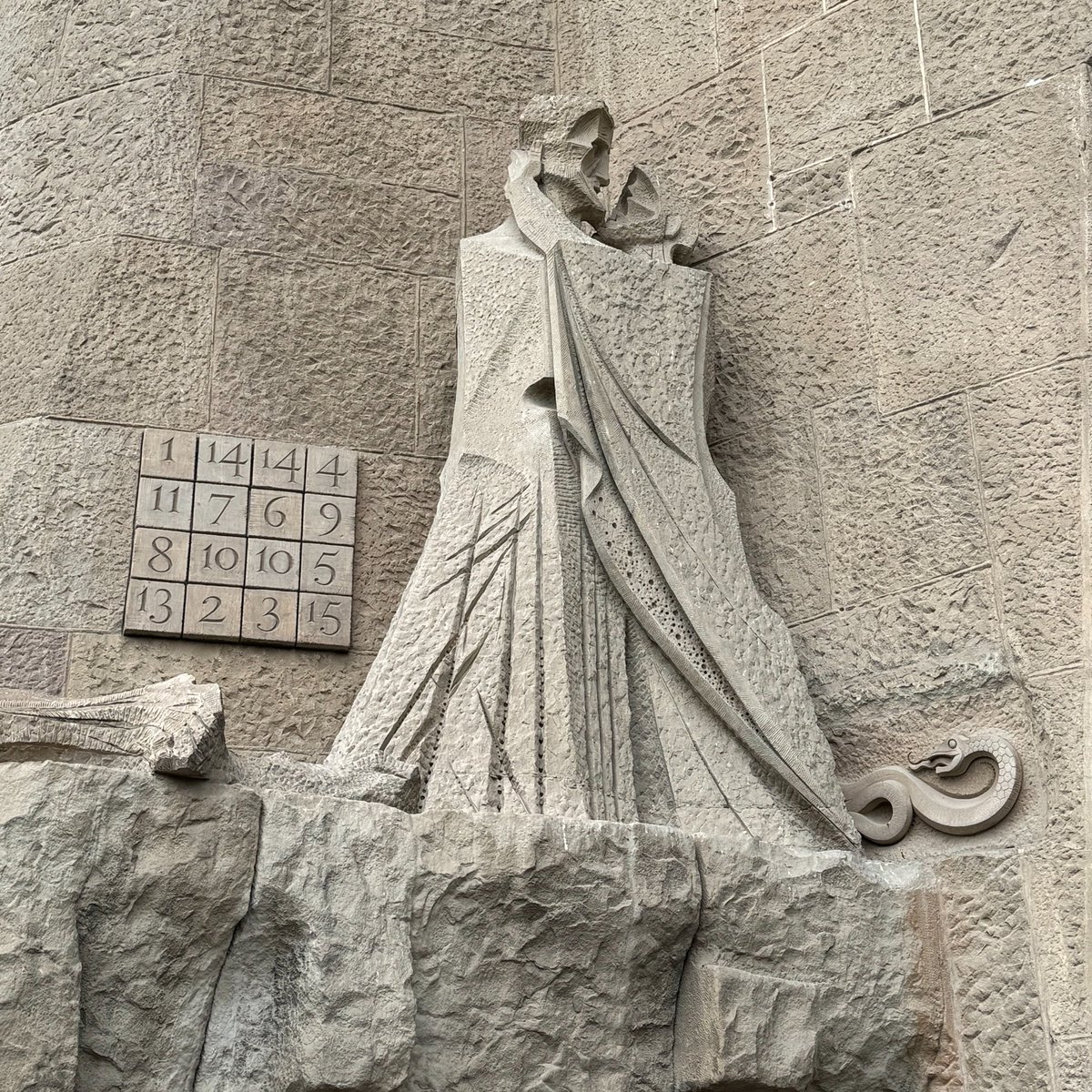 I was at Casa Milà admiring the stonemasonry and wondering; at that moment I overheard a guide say the building had 33 balconies and laughed. But then at the Sagrada Família I saw this magic square adding up to 33 in all directions and realized it was not a coincidence