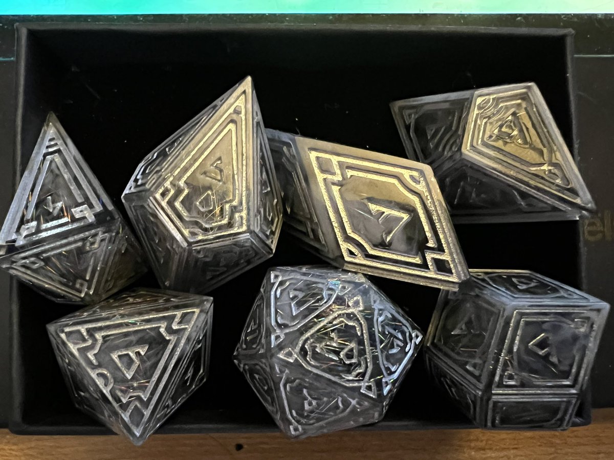 Finally got time to take a couple pictures of the gorgeous dice I purchased from @AstrusTreasures! Can’t wait to roll them in my next D&D session! ✨✨