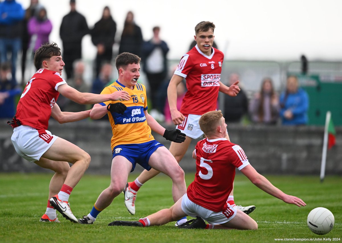 Conor Burke of Clare in action against Aaron Keane, Cathal McCarthy and Harry Cogan of Cork during their Munster Minor Football Championship game at Quilty. Photograph by John Kelly. The score after the third quarter is @GaaClare 0-05 , @OfficialCorkGAA 1-11 @MunsterGAA #GAA