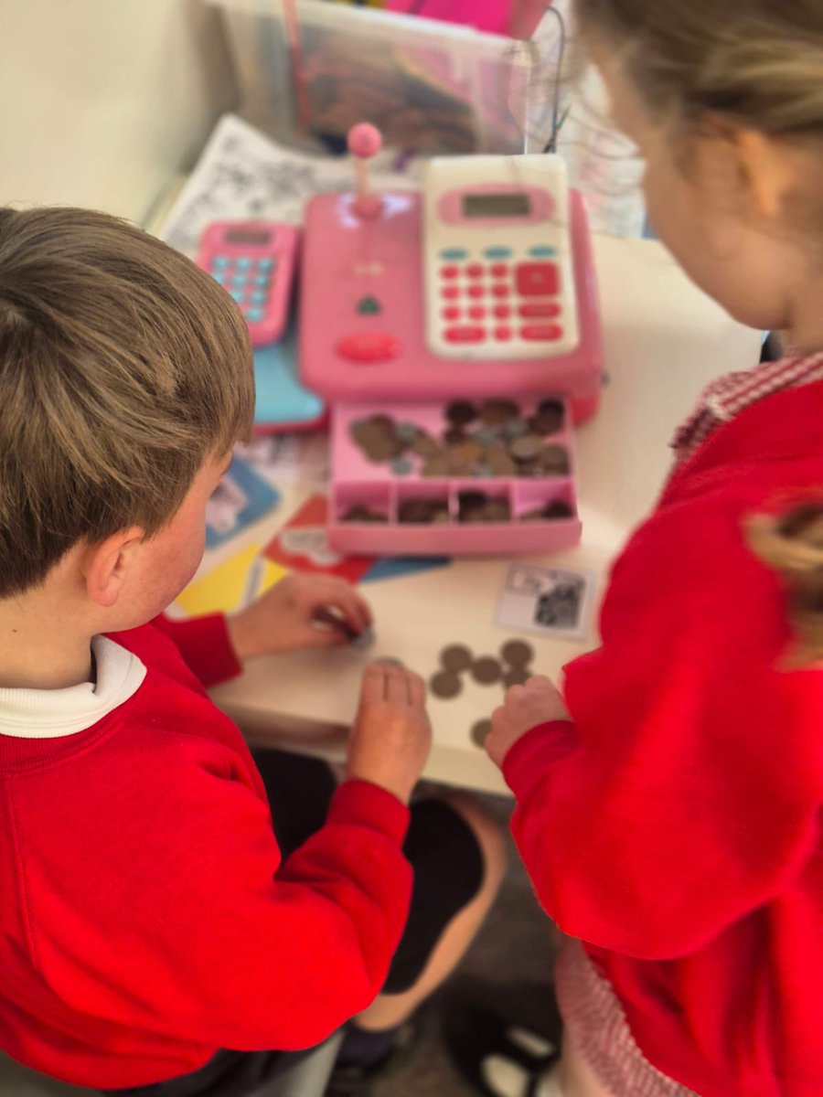 Acorns are learning about money and playing shops to help them to understand.