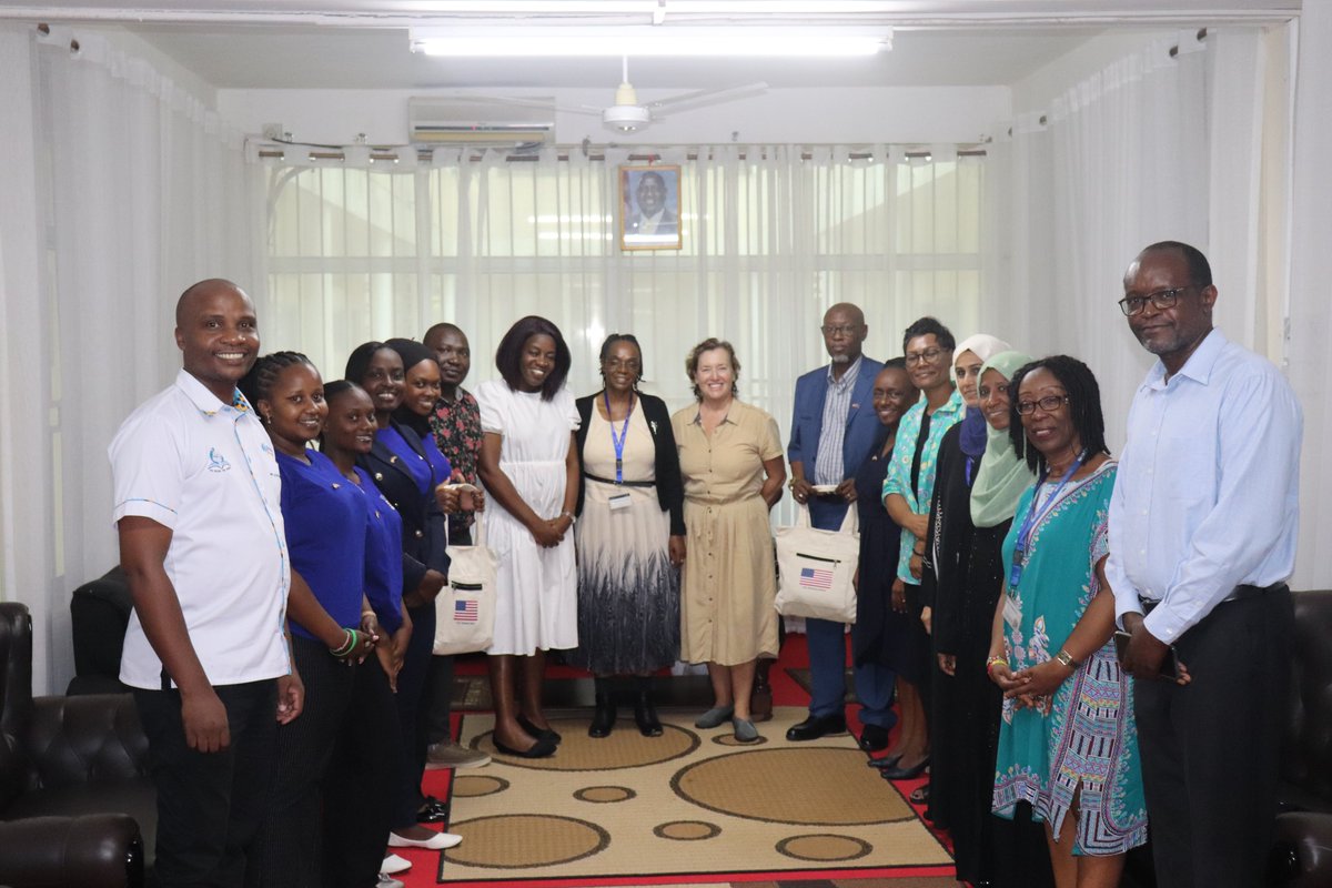 Jennifer Maende, Educ. Outreach Coordinator, Embassy of the USA (4th centre left), poses for a group photo during a visit to PU recently. In the picture are Prof J. Kahindi, VC,PU, Prof. H. Mondoh, DVC-AFP (center left), Christine Hess (center right) and other PU staff.