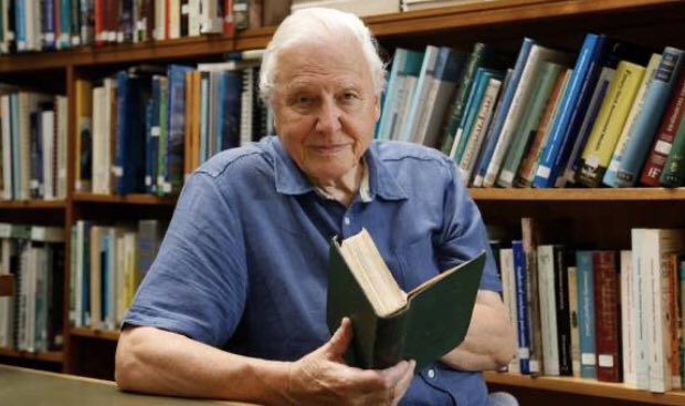 #HappyBirthday Sir David Attenborough from @ZSLLibrary and #Archives. Our favourite #photograph of him, holding our 1st edition of 'On the origin of species' in ZSL Library and Archives.