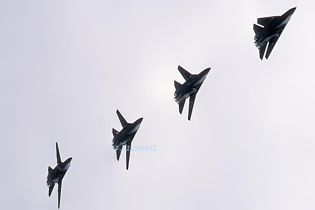 Unusual. F-111Fs at RAF Lakenheath flying in formation all with a different wing-sweep configuration at the base's airshow. credit Joe Ciliberti