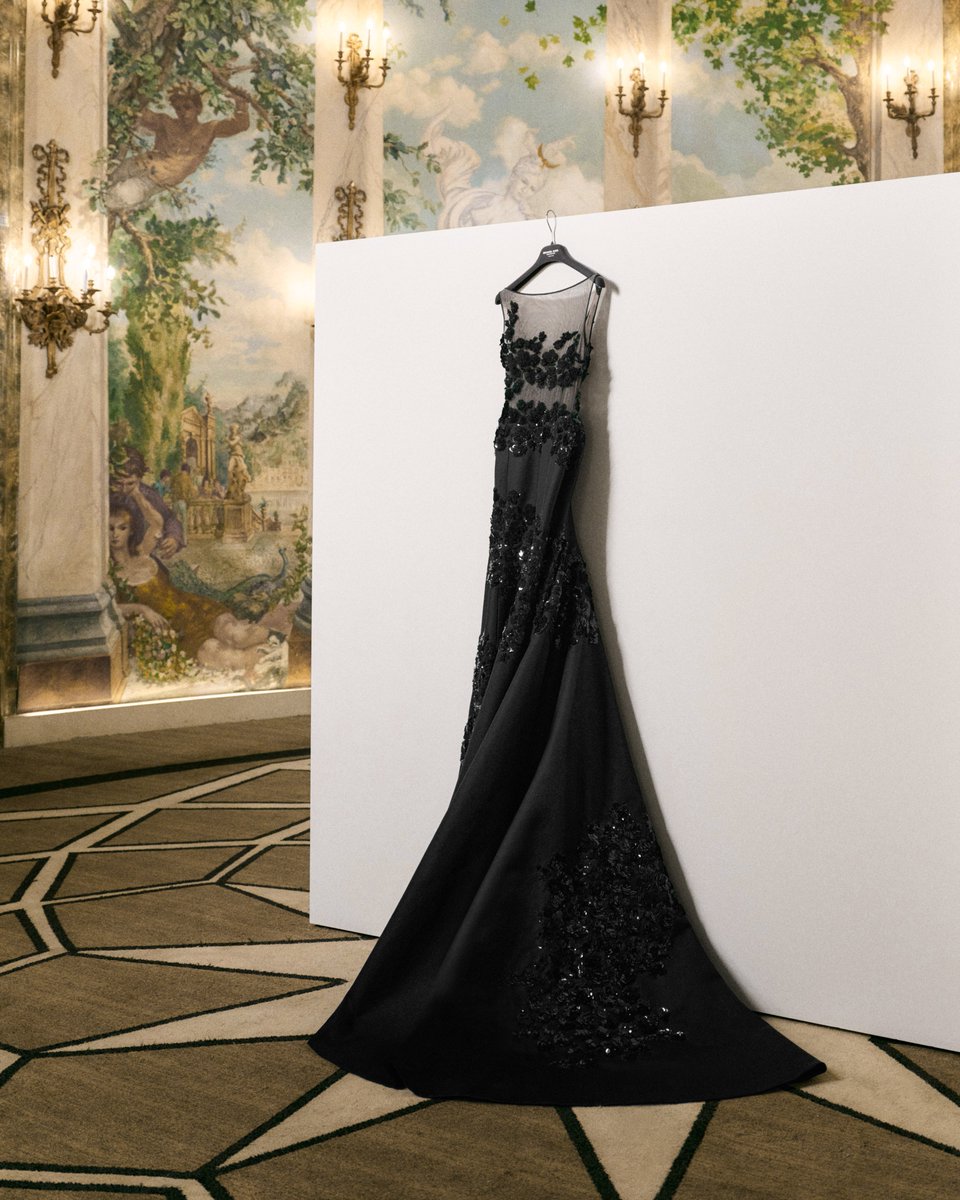 Michael’s date for the 2024 Met Gala, Meg Ryan wore a couture Michael Kors Collection black silk-and-wool mikado gown with a tulle bodice, featuring shadow floral hand-embroidery. Artisans spent over 800 hours hand-sewing 1,120 sequin flowers, each made up of dozens of recycled…