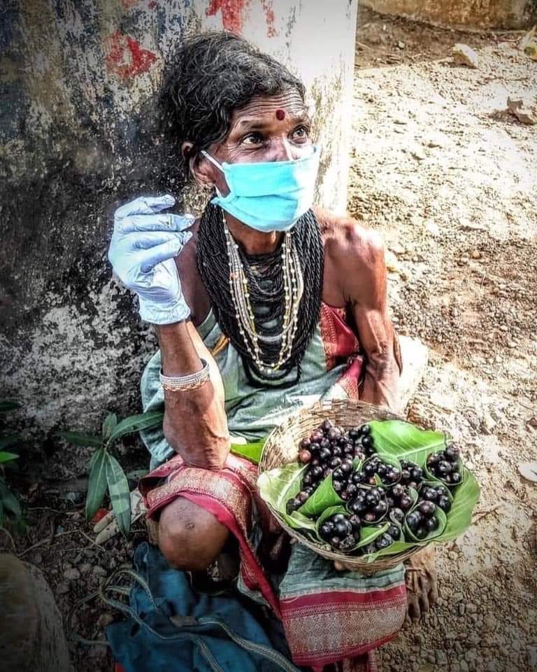 She belongs to Halakki Gowda tribe of karwar district. Fruit she is selling is “Nerle hannu” in local language. If you are wondering, biceps are natural. They still follow ancient tribal lifestyle. They are one of the fittest people i know.