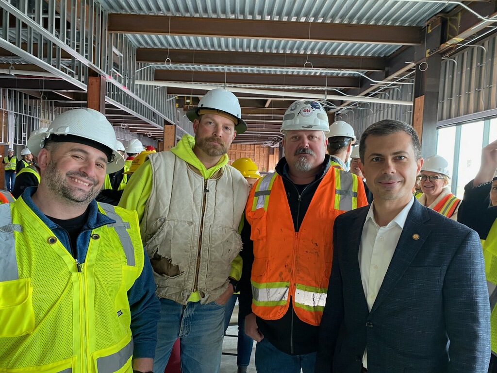 Pictured: SMART Local 103 members with DOT Secretary Buttigieg yesterday at the Missoula Airport! Local 103 is performing architectural work on the outside of the airport, thanks in large part to an influx of federal funding. #UnionStrong