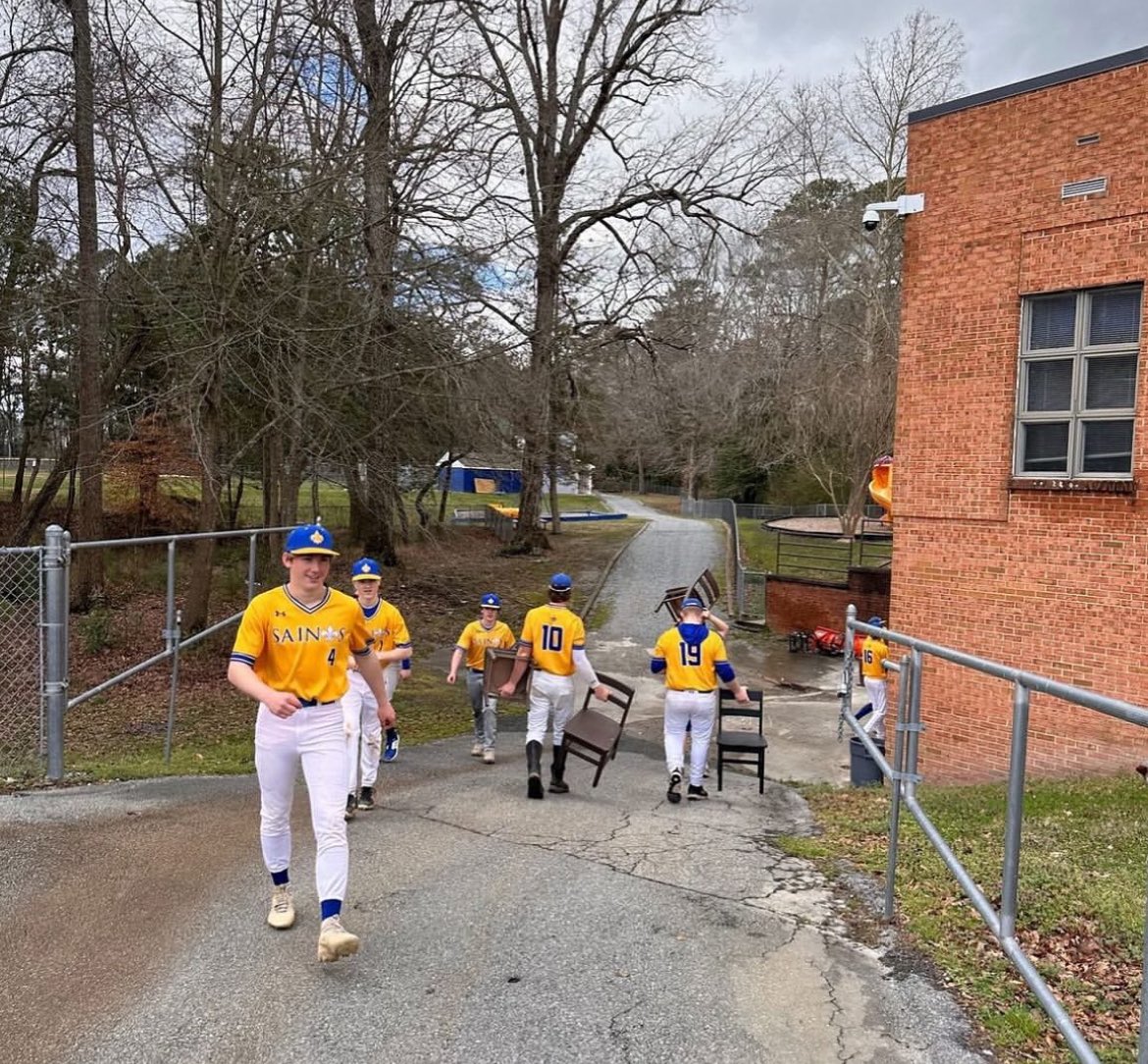 NSA_Baseball's tweet photo. Warmups sometimes happen with tables, chairs and just stepping in and helping others. Our saints are always on the move. On and off the field it’s all about teamwork. Way to go Saints! ⚜️ https://t.co/fdQWiZMx4x