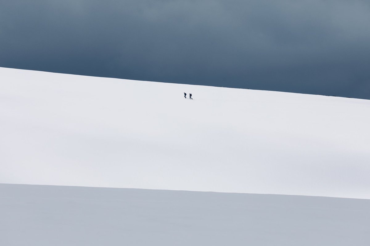 At the end of the first week in May 2021 an unusually heavy snowfall coated the Cairngorms, leaving it resembling winter, rather than late spring. It caught a few walkers out, who found themselves post-holing through deep snow, such as this pair en route to Ben Macdui. (1/4)