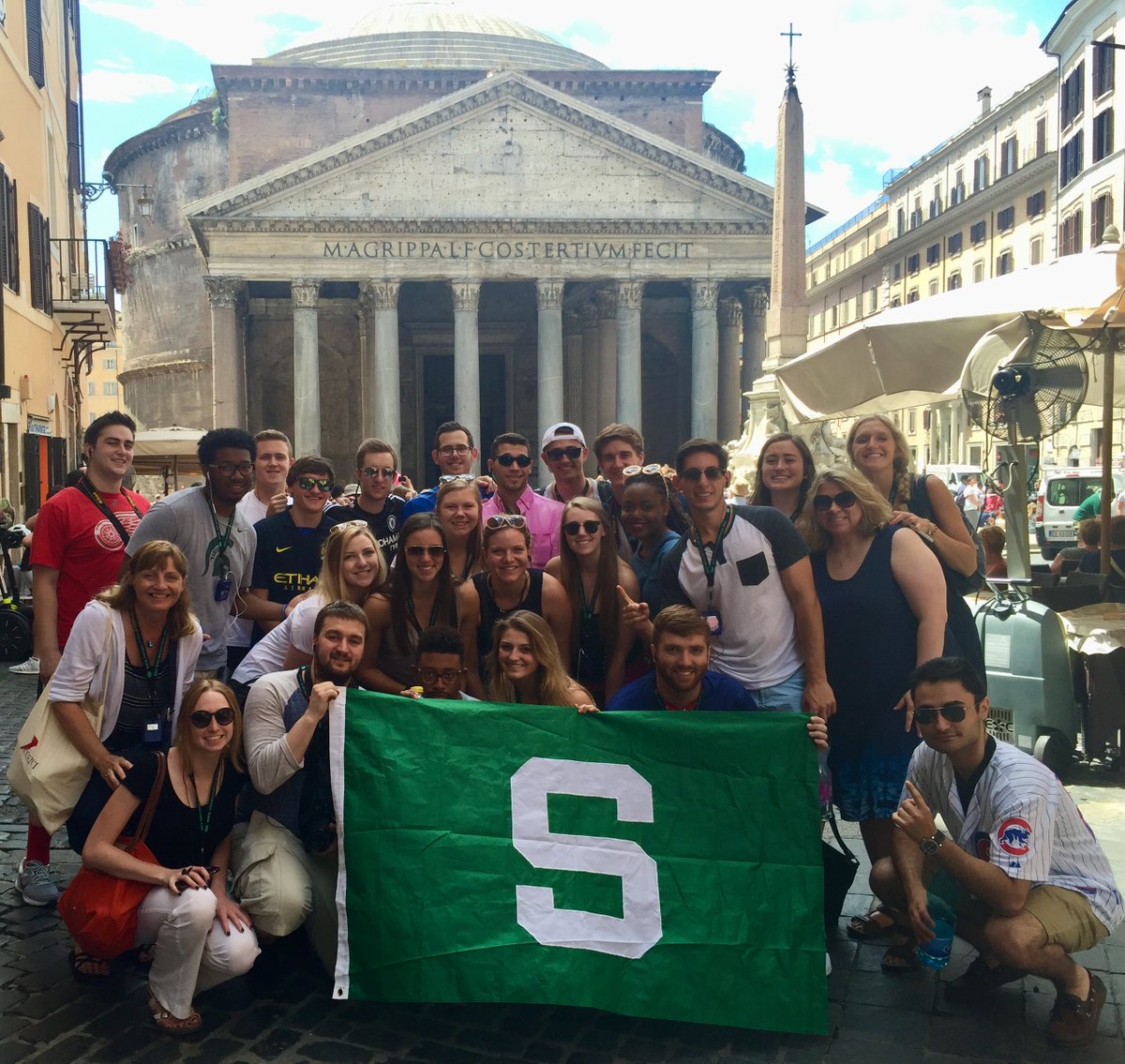 Sports JRN Study Abroad moment #2, from Team 1 (2016): The dropping of the Sparty flag for photos is a tradition that started with this class. We make memories everywhere we go, with karma so good that @dbabzi11's prayers were heard for the @Cubs to win the World Series!