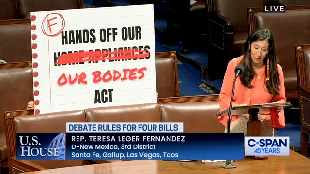 Rep. Teresa Leger Fernandez brought a placard to the House floor