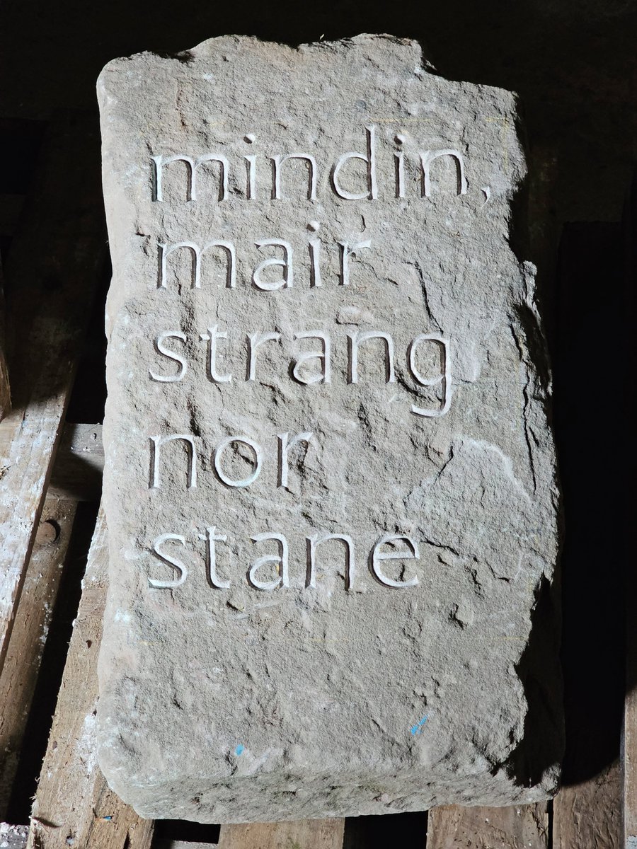 This looks photoshopped but it's not...a quick snap while moving some stones this evening. I love how different carved letters can look depending on the light.