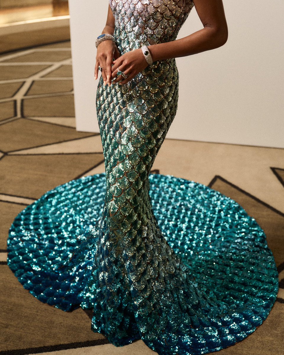 For the 2024 Met Gala, Gabrielle Union-Wade wore a couture Michael Kors Collection metallic ombré tulle mermaid gown with hand-embroidered sequins. Requiring over 9,500 hours and 12 artisans to hand embroider, the mock-neck gown features thousands of sequins in five colors and…