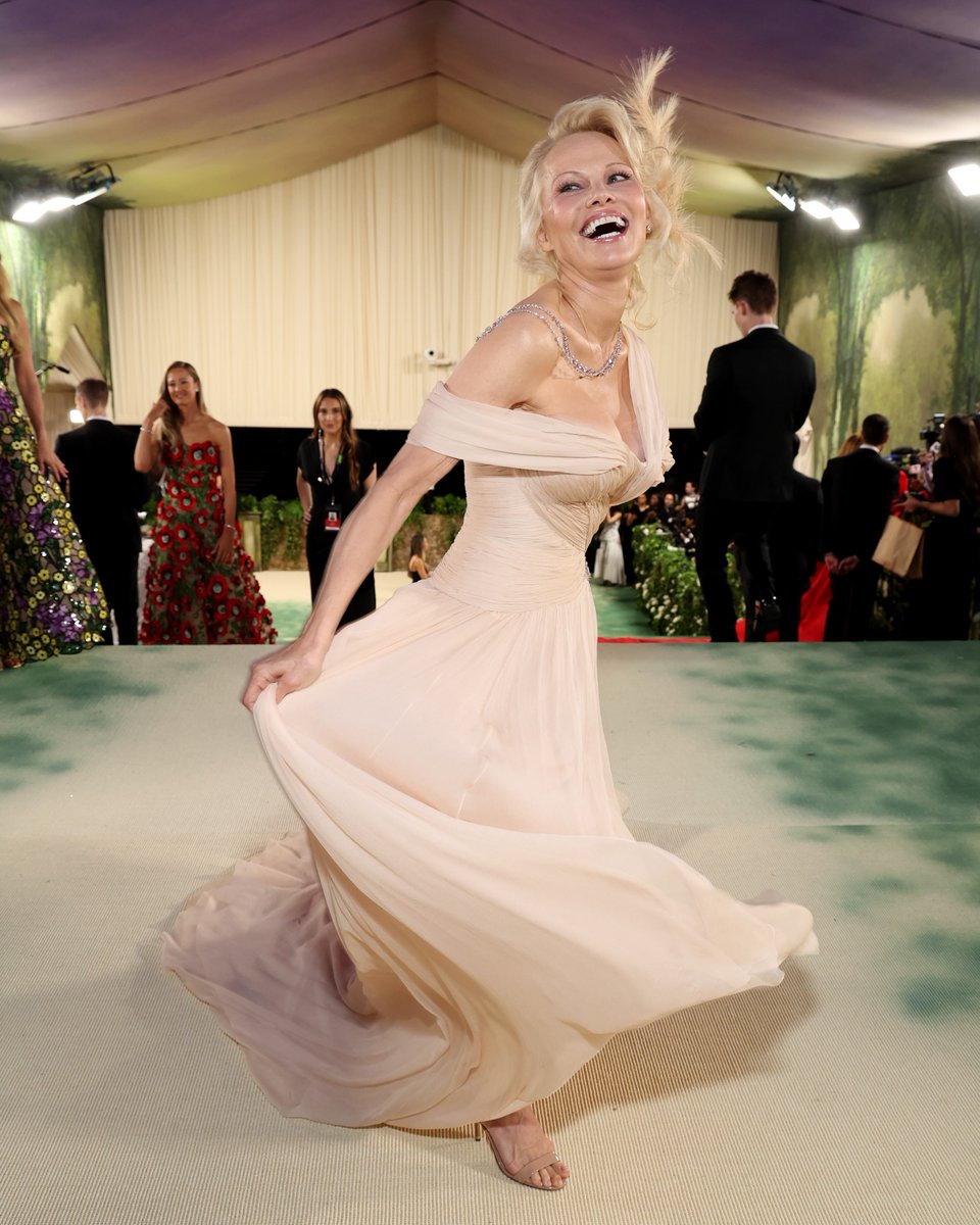 IMDb's tweet photo. No one is happier to be at the #MetGala than Pamela Anderson. 💛 https://t.co/pjp9J6CZcm