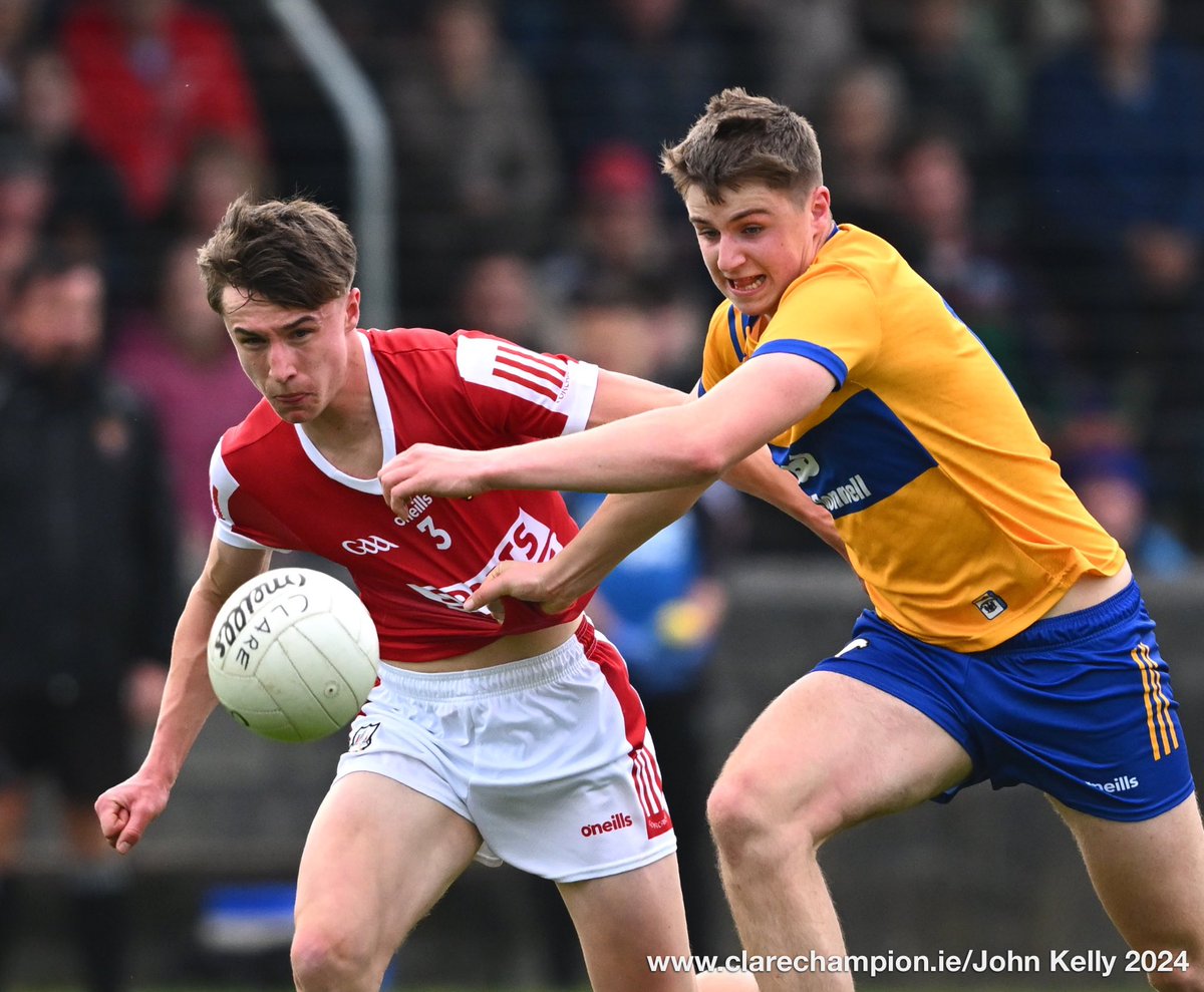 Sean Fennell of Clare in action against Aaron Keane of Cork during their Munster Minor Football Championship game at Quilty. Photograph by John Kelly The score after the first quarter is @GaaClare 0-01 , @OfficialCorkGAA 1-06 @MunsterGAA #GAA