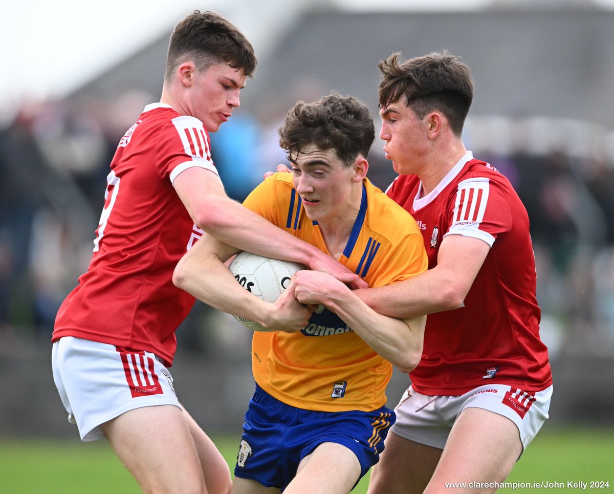 Colm Downes of Clare in action against Ben O’Shea and Danny Miskella of Cork during their Munster Minor Football Championship game at Quilty. Photograph by John Kelly. The score at half time is @GaaClare 0-01 , ⁦@OfficialCorkGAA⁩ 1-07 @MunsterGAA #GAA