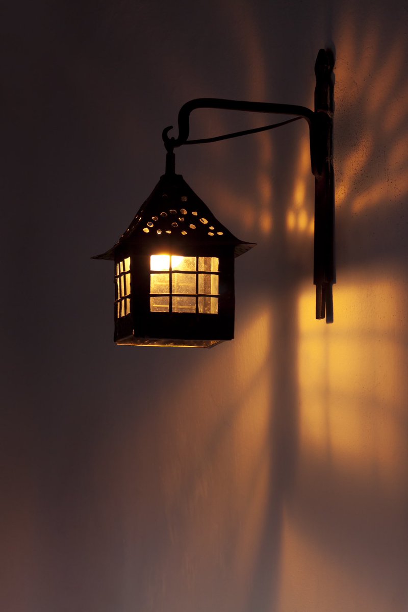 Antique wall lamp glowing in the night #walllights #shadowwork #nightlight #lightdesign #lanterns #lights #lighting #lightideas
