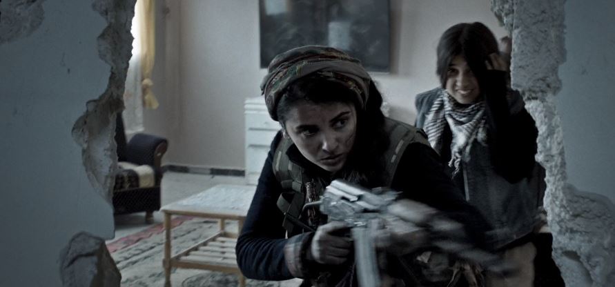 #Kobane (2022)   
Despite being outnumbered and outgunned, a female Kurdish fighter guides her fellow fighters in the resistance to defend their city, Kobane, from the deadly threat of ISIS. A real story of war, sacrifice, love and hope.
#GirlsWithGuns #FilmX 📽️  🎬