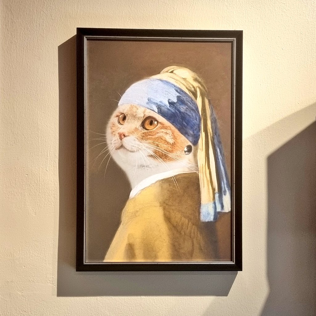 Puss with the pearl earring.