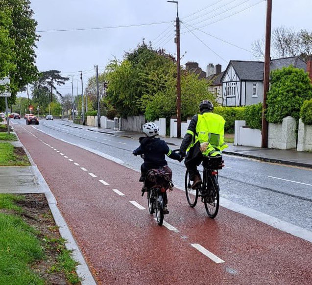 This has certainly brightened up my day! The hand holding, dog in the back, cycling despite the rain! Amazing