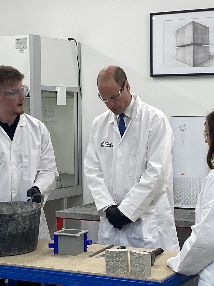 The Prince has just learned how a concrete cube is made. One technician has just pulled out a pre-made one. “Here’s one he made earlier”, William says.