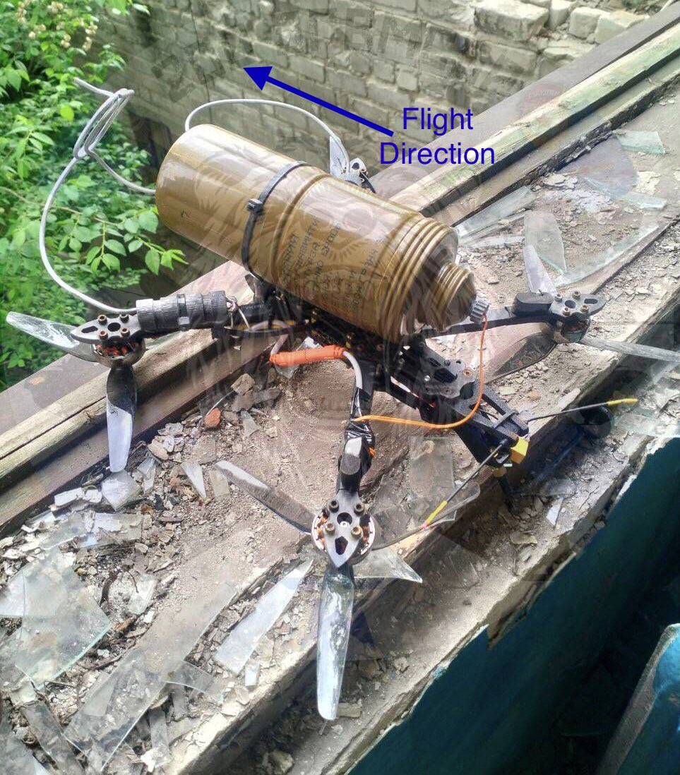 This downed Ukrainian FPV drone carries part of an old Russian RKG-3 shaped-charge grenade with an improvised electrical fuze. This obsolete hand grenade designed in 1950 has been resurrected as a precision guided armor killer when mounted on a drone. 1/2