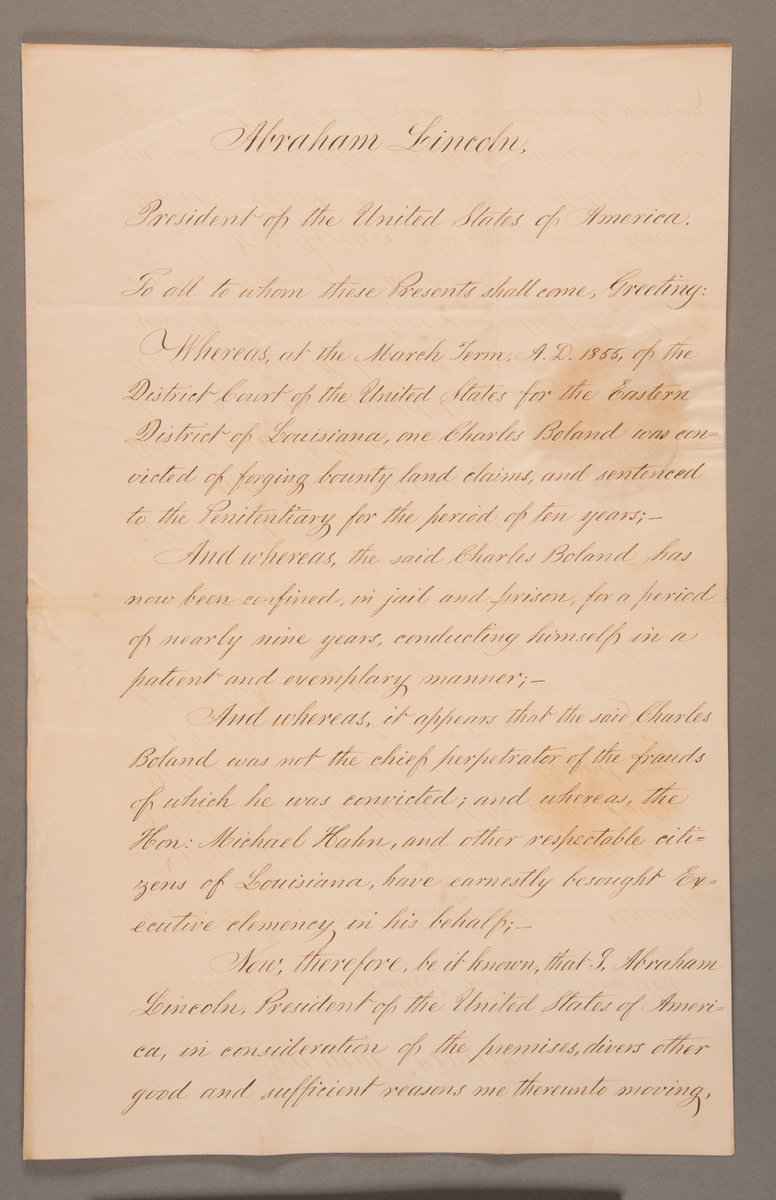 Tomorrow marks the beginning of #PreservationMonth. This Presidential Pardon signed by #AbrahamLincoln was stabilized before digitization. The document had been stored folded in the past, and was torn along these fold lines. Conservation staff gently flattened it under weight.