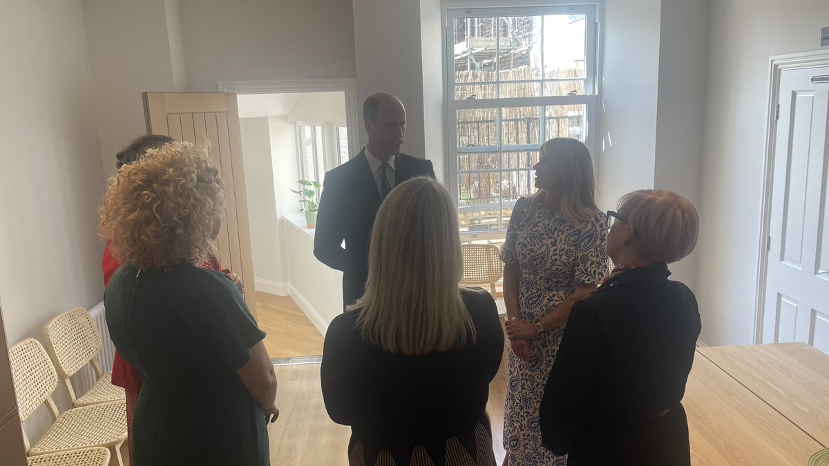 Prince William speaks to stakeholders in the kitchen area of James’ Place.