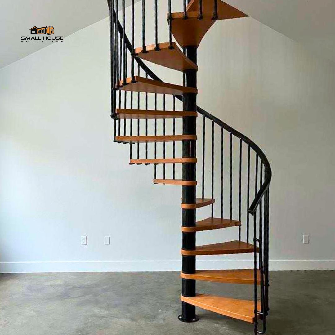 Spiral up to sophistication in the Modern Craftsman - Waco. This staircase isn’t just a feature, it’s a focal point, marrying the warmth of wood with the strength of metal. A perfect twist to your home's story. #SmallHouseSolutions #moderncraftsman #staircase