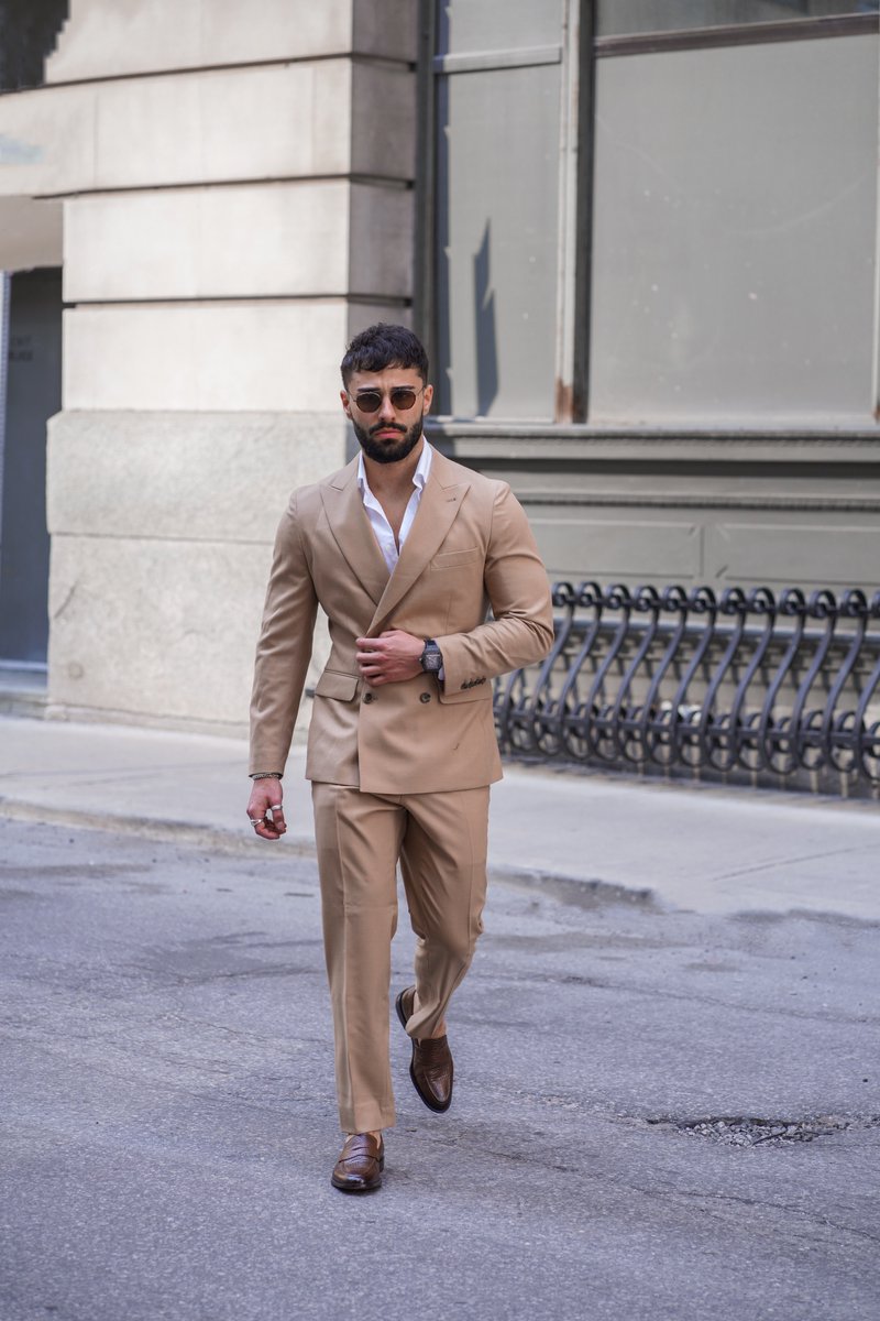 Hope you're all walking into the work week as confidently (and stylishly) as @nandosirianni in our double-breasted Herringbone Light Brown Suit.