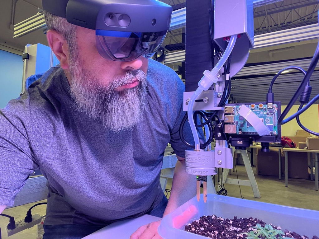 Featured here is Luis Torres from Puerto Rico 😎 'In our T-Mobile Puerto Rico & E4 5G NB-IOT Innovation LAB we are working on a project to measure Plant Stress using Cameras and Lidar together with the HoloLens 2 connected to one of our @farmbotio @HoloLens' #FarmBot