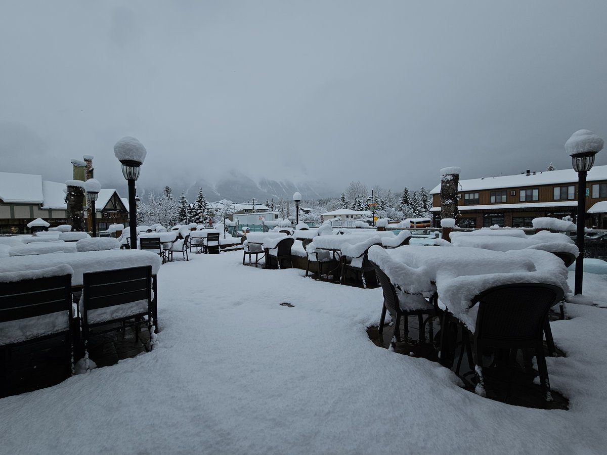 🌨❄️ Don't let a little snow stop you from enjoying the great outdoors! Our patio is always open, even on snow days like today. Who's up for some winter adventure and hot cocoa? Come brave the elements with us! #WoodRestaurant #SnowDayPatioParty #WinterWonderland #Canmore🎿🍻