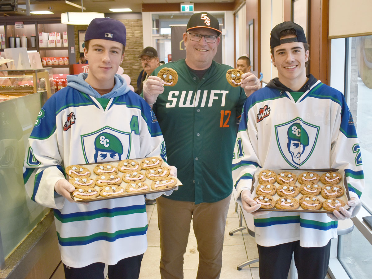 Mayor of <a href="/City_SC/">Swift Current</a> Al Bridal and <a href="/swiftcurrent57s/">Swift Current 57's</a> President Brad Woods joined members of the Wildcats and Legionnaires hockey teams to decorate smile cookies at Tim Hortons. All proceeds from #SmileCookie Week campaign in #SwiftCurrent will go to the Southwest Facility Foundation.