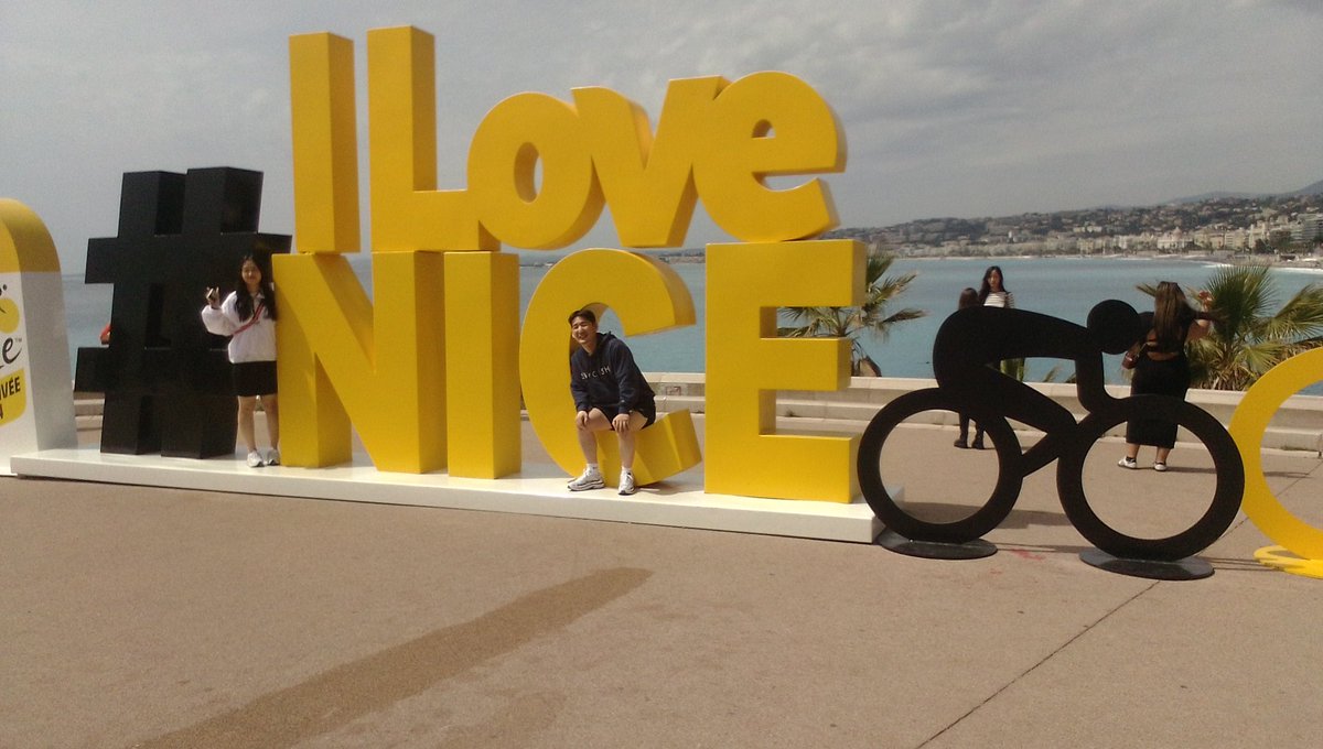 explorenicecotedazur.com/larrivee-du-to…. Tour de France 2024, July 7th at Nice Côte d:Azur view #ILoveNice sign #TourDeFrance