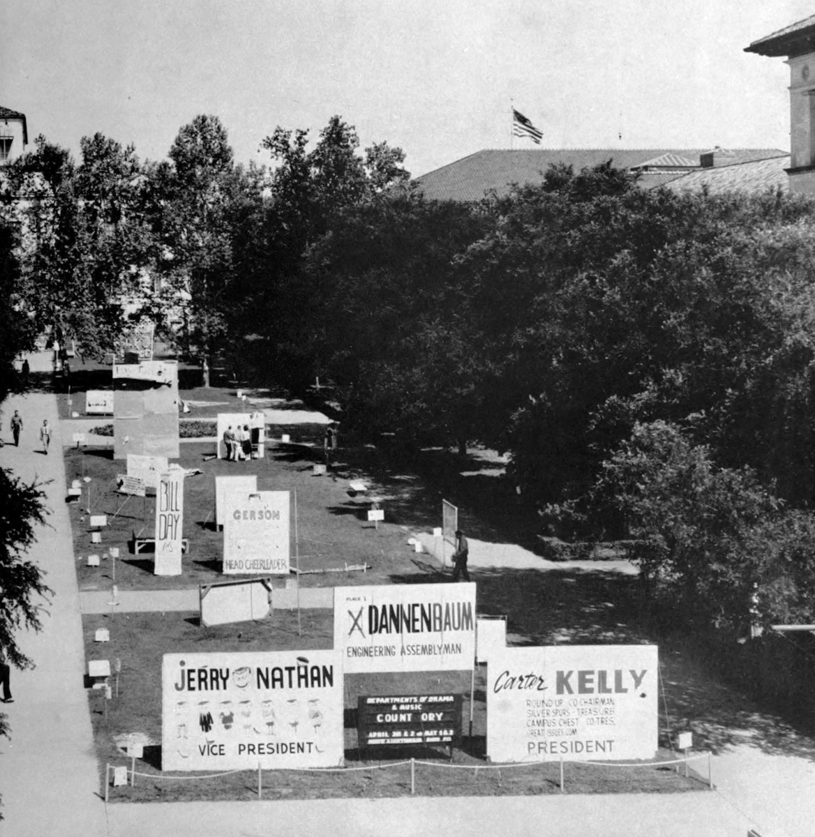 1959: Before the planters were added in the mid-1970s, @UTAustin's West Mall was mostly grass. In the springtime leading up to campus elections, it was usually home to large campaign signs, some of them a couple of stories tall.