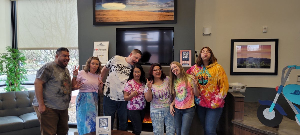 It's National Tie Dye Day! 🎨 Here's a #throwback to when our whole staff rocked their favorite tie-dye creations. Have you ever tie-dyed clothes before? Share your vibrant results with us! #TieDyeDay #ColorfulCreations #ExpressYourself