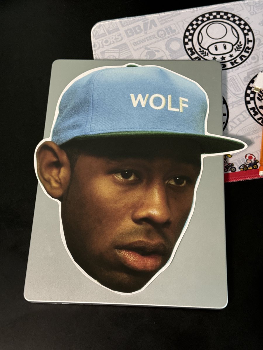 Big ass Tyler sticker on top of my laptop for size comparison