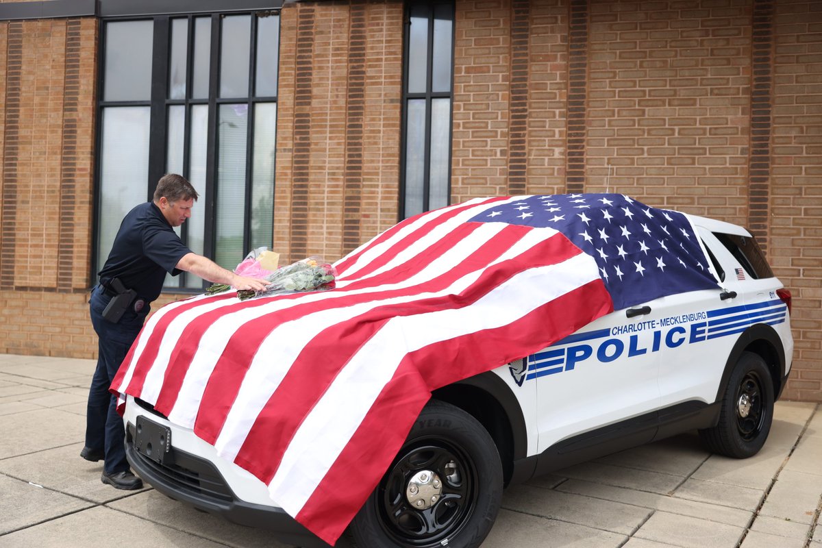A memorial outside CMPD North Tryon Division where fallen Officer Joshua Eyer worked. <a href="/theobserver/">The Charlotte Observer</a>