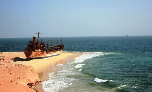 Homesick. Mauritania's long Atlantic shoreline is one of the world's largest ship graveyards. This much-photographed beached ship appears to be looking wistfully to the sea as if longing to sail again.