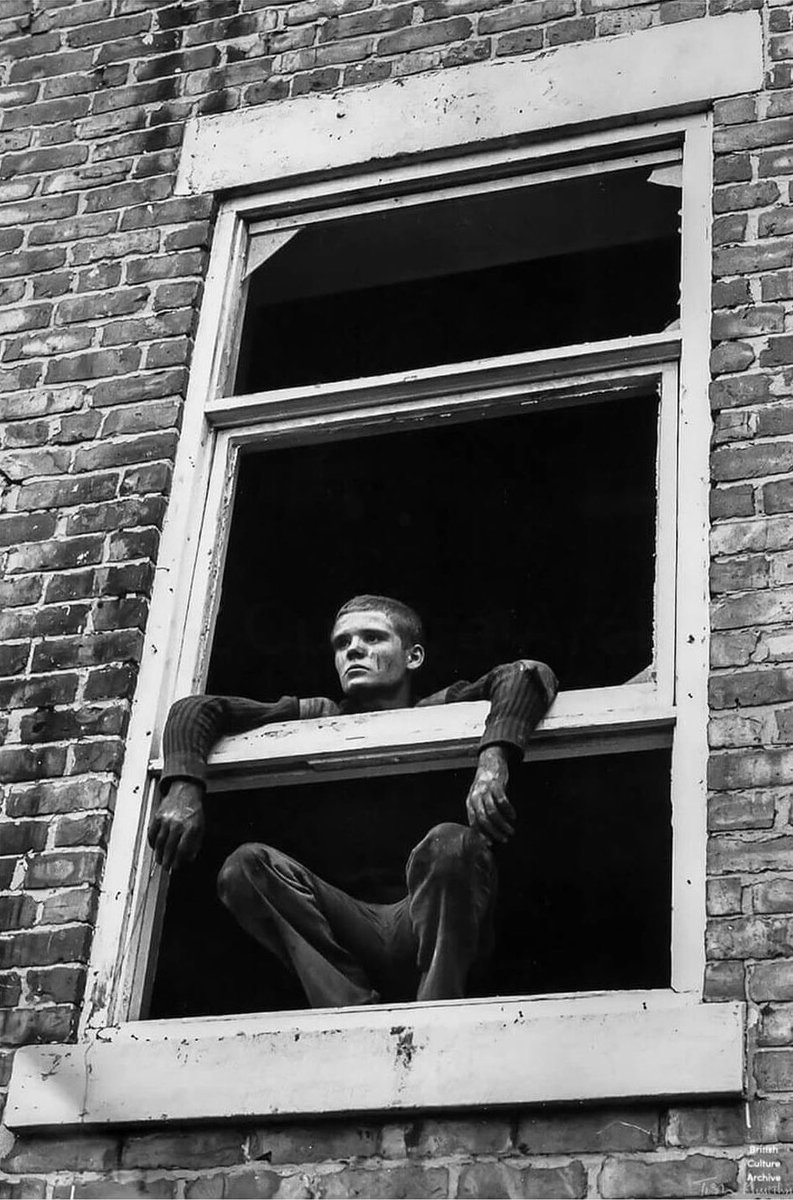 Glenn in the window by Tish Murtha. From the series Youth Unemployment (1981). Photo © Ella Murtha, all rights reserved.