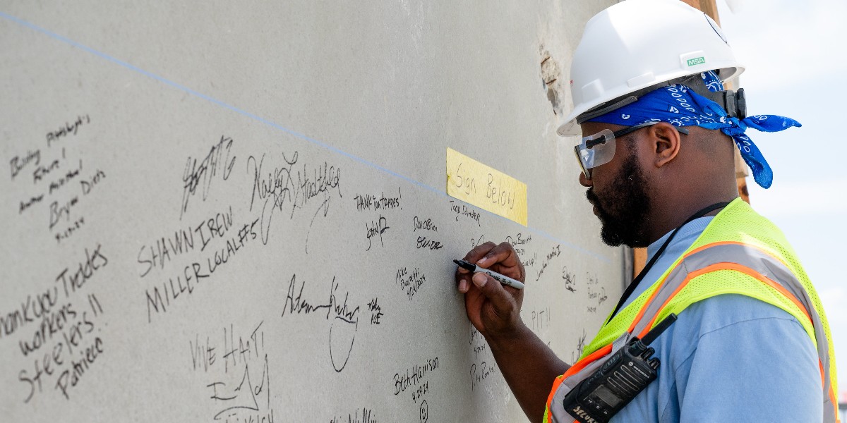 We're excited to celebrate a new parking garage milestone! We invited a group, including tradespeople who worked on the project and PIT employees, to sign one of the last concrete pieces to be placed. The garage will triple the covered parking! 🚗 ➡️ brnw.ch/21wJkzO