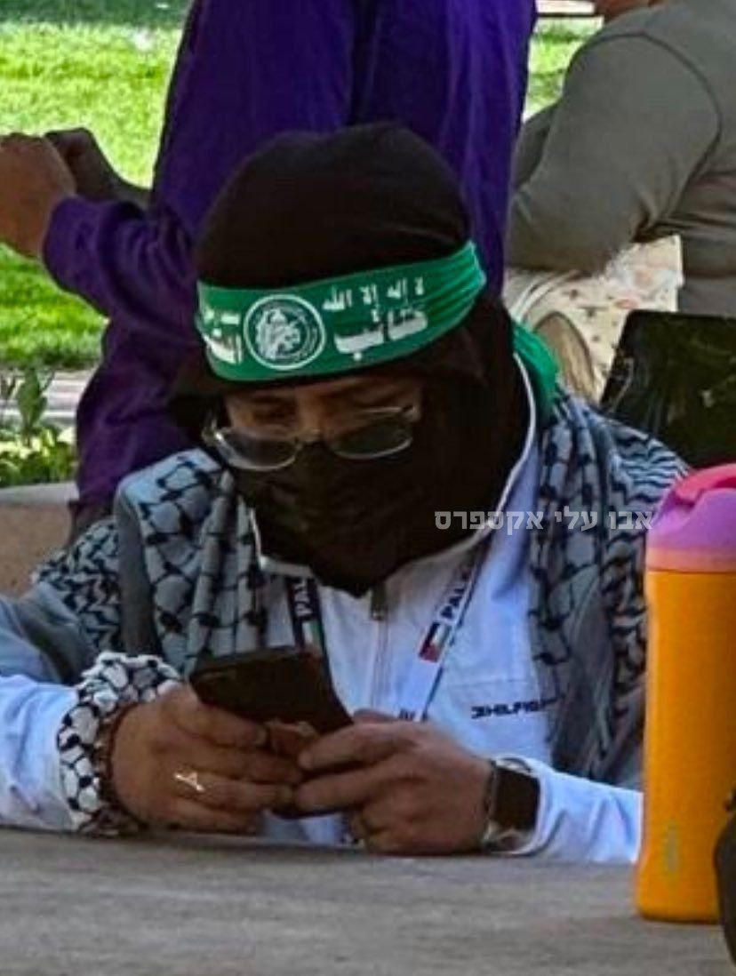 Stanford University in California: A student, wearing a Hamas headband, prepares for class. Vote Trump to Save America