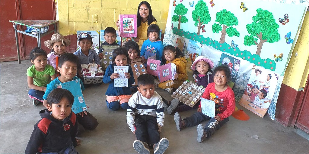Students in #Guatemala, led by Claudia, a first-year teacher in the Child Aid program, celebrate having new books in their school! Claudia put on a book fair in her classroom with several learning stations with fun activities. #GlobalEd #Pd4uandme #EduChat #ChildAidClassrooms