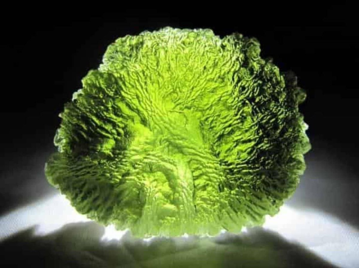 Moldavite is a green , olive green or blue green vitreous silica projectile rock formed by a meteorite impact in southern Germany (Nördlinger Ries Crater) occurring around 15 million years ago. It’s a kind of tektites.
Photo credit by Geo Wonders