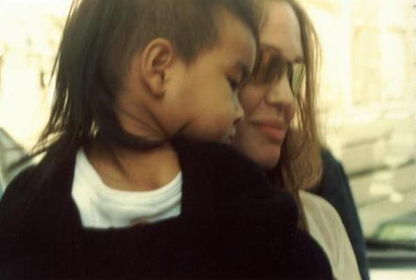 #AngelinaJolie Date: May 31, 2004 | Location: Cannes, France Angelina and Maddox leaving the hotel
