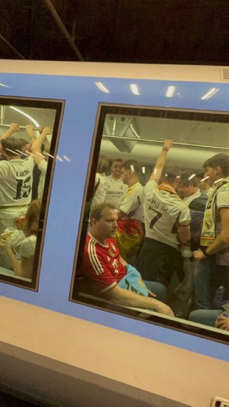 A Bayern fan on a train full of Real Madrid fans